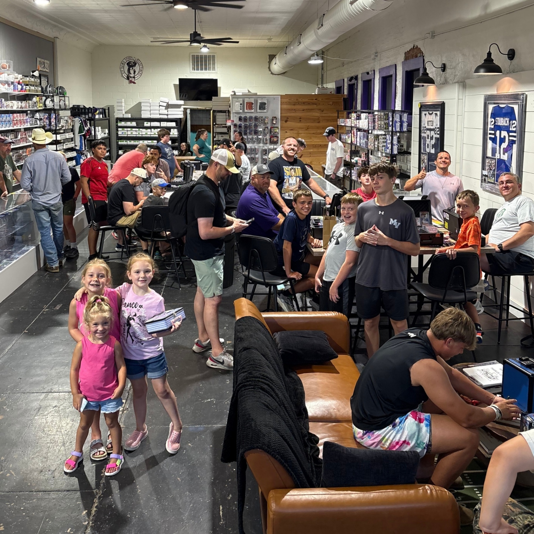 A packed shop floor during trade night